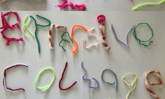 Wool spelling out the words 'expressive collage'